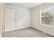 Serene bedroom featuring a window overlooking the green outdoors and plush carpet at 373 Austin Dr, Avon, IN 46123