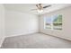 This spacious bedroom has neutral walls, new carpet and a large window at 373 Austin Dr, Avon, IN 46123