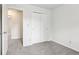 A bright bedroom featuring neutral walls, plush carpet, and closet space for easy organization at 373 Austin Dr, Avon, IN 46123