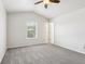 This spacious bedroom has neutral walls, new carpet and a large window at 373 Austin Dr, Avon, IN 46123