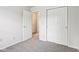 Neutral bedroom showcasing plush carpet, bright walls, and convenient closet access at 373 Austin Dr, Avon, IN 46123