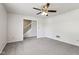 This cozy bedroom features a ceiling fan, neutral walls, and soft new carpet at 373 Austin Dr, Avon, IN 46123