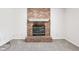 A cozy red brick fireplace with a white mantel and black screen is the focal point of the room at 373 Austin Dr, Avon, IN 46123