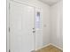 A classic white paneled front door with a side window welcomes you into the home at 373 Austin Dr, Avon, IN 46123