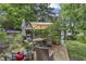 Backyard patio with seating, umbrella, and lush greenery, perfect for outdoor relaxation at 38 W Main St, Brownsburg, IN 46112