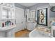 Traditional bathroom with stained glass window, vanity, and clawfoot tub at 38 W Main St, Brownsburg, IN 46112