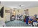 This bedroom features carpet flooring, natural lighting, a ceiling fan, and neutral wall coloring at 38 W Main St, Brownsburg, IN 46112