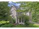 Charming two-story home featuring a beautiful front porch and mature trees, perfect for relaxed outdoor living at 38 W Main St, Brownsburg, IN 46112