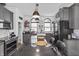 Open concept kitchen featuring a center island, modern lighting, and stainless steel appliances, perfect for Gathering and friends at 38 W Main St, Brownsburg, IN 46112