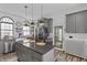 Stylish kitchen with a farmhouse sink, dark countertops, and modern appliances, creating a functional and elegant space at 38 W Main St, Brownsburg, IN 46112