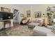 Cozy living room featuring hardwood floors, soft lighting, and comfortable seating, ideal for relaxing and entertaining at 38 W Main St, Brownsburg, IN 46112