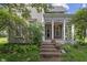 Inviting front porch with decorative columns and space for seating, creating a welcoming entrance to the home at 38 W Main St, Brownsburg, IN 46112