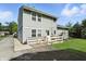 Rear exterior shot of a two-story home featuring a wooden deck, vinyl siding and a lawn at 4023 N Arlington Ave, Indianapolis, IN 46226
