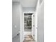 Bathroom with tiled shower and glass door visible from hallway at 4023 N Arlington Ave, Indianapolis, IN 46226