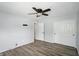 Simple bedroom with hardwood floors, a ceiling fan, and a closet at 4023 N Arlington Ave, Indianapolis, IN 46226