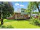 Charming home featuring a brick facade, front deck, and a well-maintained lawn at 4023 N Arlington Ave, Indianapolis, IN 46226