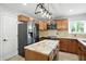 Modern kitchen with stainless appliances, granite countertops, custom cabinets, and kitchen island at 4023 N Arlington Ave, Indianapolis, IN 46226
