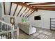 Elegant living room with vaulted ceiling, exposed beams, and a cozy sofa at 4023 N Arlington Ave, Indianapolis, IN 46226