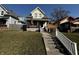 Charming two-story home with a landscaped front yard, American flag, and inviting porch at 429 Wallace Ave, Indianapolis, IN 46201