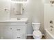 Clean bathroom with a shower-tub combo, vanity with storage, and modern fixtures at 452 N Fenton Ave, Indianapolis, IN 46219