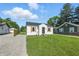 Charming house featuring new lawn and gravel driveway at 452 N Fenton Ave, Indianapolis, IN 46219