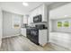 Modern kitchen equipped with white cabinets, and black appliances at 452 N Fenton Ave, Indianapolis, IN 46219