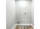 Laundry room featuring vinyl flooring, utility hookups, and neutral paint at 452 N Fenton Ave, Indianapolis, IN 46219