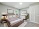 Beautiful main bedroom with modern furnishings, soft carpet and ample closet space at 452 N Fenton Ave, Indianapolis, IN 46219