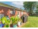 Outdoor patio with potted plants, seating area, and a barbecue grill, creating an inviting space at 4625 Beth Ann Dr, Indianapolis, IN 46221