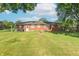 Expansive backyard featuring a well-maintained lawn and a cozy fire pit area for outdoor gatherings at 4625 Beth Ann Dr, Indianapolis, IN 46221