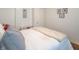 Cozy bedroom featuring a white comforter, decorative pillows, and modern wall art at 4625 Beth Ann Dr, Indianapolis, IN 46221