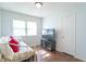 Bright bedroom featuring a daybed, natural light, and a dark entertainment center at 4625 Beth Ann Dr, Indianapolis, IN 46221