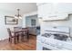 Bright kitchen and dining area with stainless steel appliances and hardwood flooring at 4625 Beth Ann Dr, Indianapolis, IN 46221