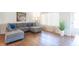 Comfortable living room featuring hardwood floors, gray sofa and bright natural light at 4625 Beth Ann Dr, Indianapolis, IN 46221