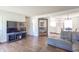 Cozy living space featuring hardwood floors, an entertainment center, and a comfortable gray sofa at 4625 Beth Ann Dr, Indianapolis, IN 46221