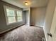 This bedroom has a neutral color scheme and carpeted flooring at 492 S Livingston Ave, Indianapolis, IN 46241