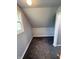 Angled-wall bedroom featuring new paint, carpeting and a window for natural light at 492 S Livingston Ave, Indianapolis, IN 46241