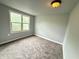 This bedroom has a neutral color scheme and carpeted flooring at 492 S Livingston Ave, Indianapolis, IN 46241