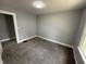This bedroom has a neutral color scheme and carpeted flooring at 492 S Livingston Ave, Indianapolis, IN 46241