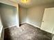 This bedroom has a neutral color scheme and carpeted flooring at 492 S Livingston Ave, Indianapolis, IN 46241
