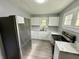 Modern kitchen featuring stainless steel appliances, white cabinets, and a stylish countertop at 492 S Livingston Ave, Indianapolis, IN 46241