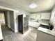 Beautiful kitchen featuring stainless steel appliances, white cabinets, and sleek countertops at 492 S Livingston Ave, Indianapolis, IN 46241