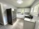 Modern kitchen featuring stainless steel appliances, white cabinets, and sleek countertops at 492 S Livingston Ave, Indianapolis, IN 46241