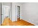 This bedroom features a closet, natural light, and hardwood floors at 5407 Adelaide St, Indianapolis, IN 46203