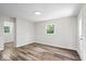 This cozy bedroom is bathed in natural light and features attractive flooring at 5407 Adelaide St, Indianapolis, IN 46203