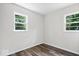 This bright bedroom features a pair of windows and attractive flooring at 5407 Adelaide St, Indianapolis, IN 46203