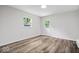This airy bedroom boasts wood floors, and neutral wall paint for personalization at 5407 Adelaide St, Indianapolis, IN 46203