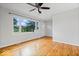 Bright living room featuring gleaming hardwood floors and lots of natural light at 5407 Adelaide St, Indianapolis, IN 46203