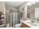 Neutral bathroom featuring a tub with a shower, decorative curtain, toilet, towels, and a vanity at 5659 Augusta Woods Dr, Plainfield, IN 46168