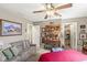 Relaxing bedroom with a seating area, natural light, and closet access at 5659 Augusta Woods Dr, Plainfield, IN 46168